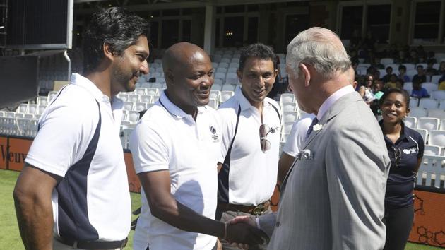 Britain's Prince Charles, the Prince of Wales, interacts with Kumar Sangakkara, Brian Lara and Azhar Mahmood during the launch. (AP)