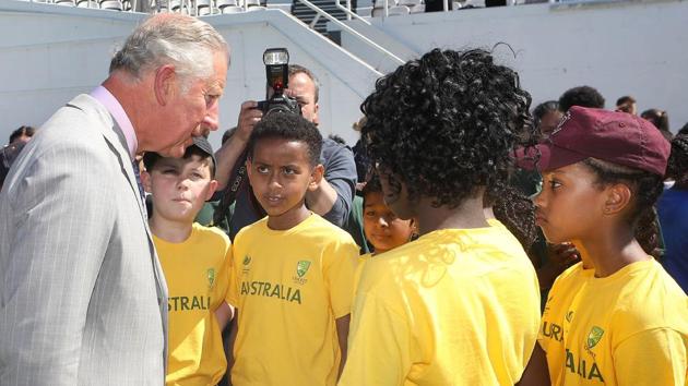 Britain's Prince Charles, Prince of Wales meets children taking part in a youth cricket competition. (AFP)