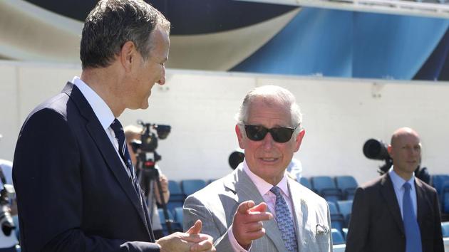 Britain's Prince Charles oversees the preparation during a youth cricket match with Surrey County Cricket Club chairman, Richard Thompson. (AFP)