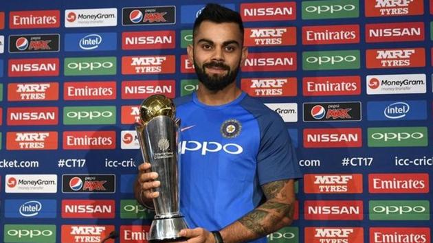 India captain Virat Kohli poses with the ICC Champions Trophy during a press conference ahead of the 50-over tournament.(Reuters)