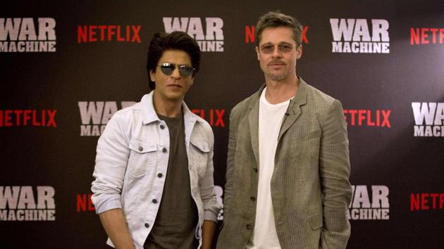 In this handout photograph released by Netflix on May 24, 2017, Shah Rukh Khan and Brad Pitt pose for a photograph during the Indian premiere of forthcoming Netflix film War Machine in Mumbai. (AFP) In this handout photograph released by Netflix on May 24, 2017, Shah Rukh Khan and Brad Pitt pose for a photograph during the Indian premiere of forthcoming Netflix film War Machine in Mumbai. (AFP)