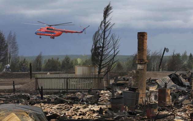 Many homes have been burned down in the Krasnoyarsk region, Siberia. (Ilya Naymushin / Reuters) Many homes have been burned down in the Krasnoyarsk region, Siberia. (Ilya Naymushin / Reuters)