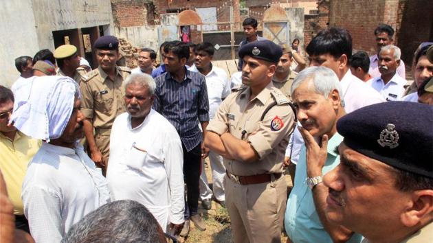 District officials and police interact with villagers in violence-hit Shabbirpur village of Saharanpur district on Thursday. (PTI) District officials and police interact with villagers in violence-hit Shabbirpur village of Saharanpur district on Thursday. (PTI)