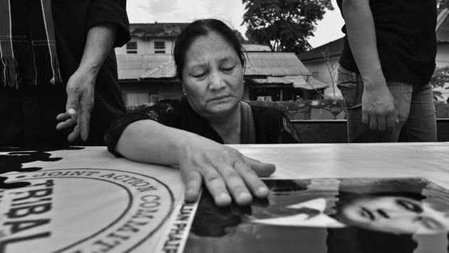 Mother of Thangzalian Phaipi, a victim of the firing, mourns next to his coffin. The protests, in which the 9 lost their lives, were triggered after the Manipur government passed three bills, which were viewed as an act of aggression by the people of the valley, the Meiteis, who saw them as an onslaught on their living and land rights as well as their identity. (Ravi Choudhary/HT PHOTO)