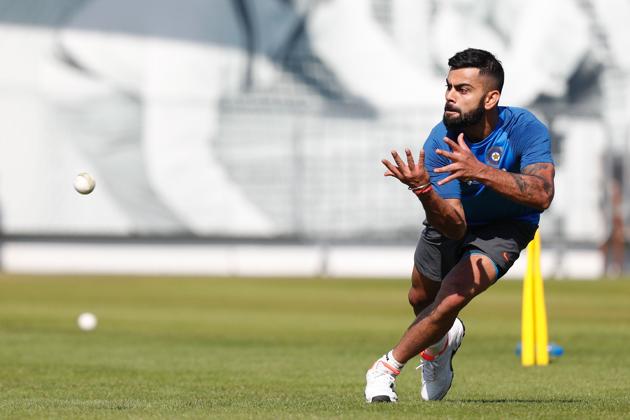 India's Virat Kohli takes a catch during a practice session at Lord's Cricket Ground in London. (AFP) 