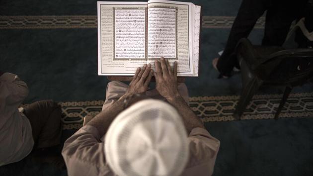 A Palestinian man reads a copy of the Koran, Islam's holiest book, at the al-Omari mosque in Gaza City. (AFP) A Palestinian man reads a copy of the Koran, Islam's holiest book, at the al-Omari mosque in Gaza City. (AFP)