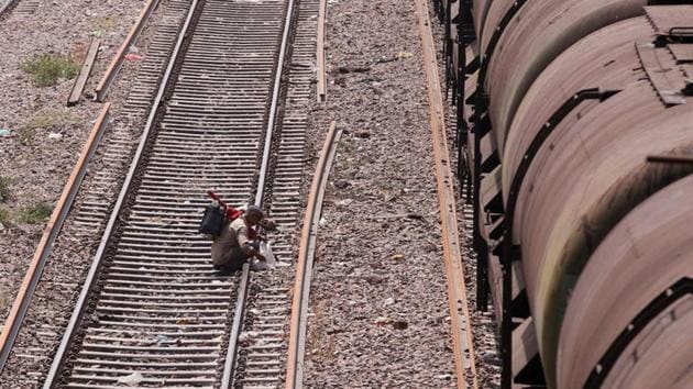 An employee checks a railway track next to a tanker wagon train at Okhla railway station in New Delhi. (REUTERS) An employee checks a railway track next to a tanker wagon train at Okhla railway station in New Delhi. (REUTERS)