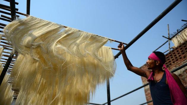 An Indian worker dries vermicelli, a traditional sweet dish, at a factory in Allahabad. (Sanjay Kanojia/AFP) An Indian worker dries vermicelli, a traditional sweet dish, at a factory in Allahabad. (Sanjay Kanojia/AFP)