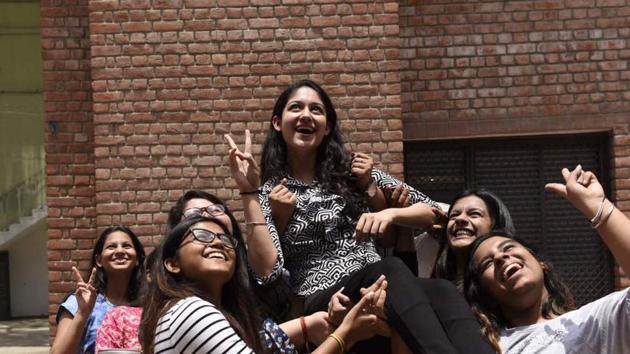 Girls celebrate after seeing their CBSE Class 12th result at St Thomas School, New Delhi.(Saumya Khandelwal/HT photo)