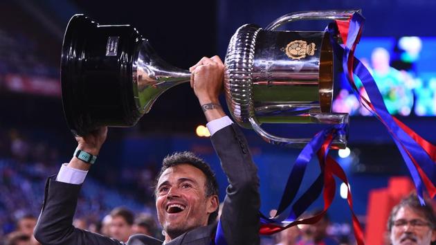 FC Barcelona coach Luis Enrique celebrtes with the Copa del Rey after beating Deportivo Alaves in the final at Vicente Calderon stadium in Madrid on Saturday.(AFP)