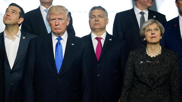 (L-R) Greek Prime Minister Alexis Tsipras, U.S. President Donald Trump, Hungarian Prime Minister Voktor Orban and Britain's Prime Minister Theresa May pose during a family photo at the start of NATO summit at their new headquarters in Brussels, Belgium. (Jonathan Ernst / REUTERS)