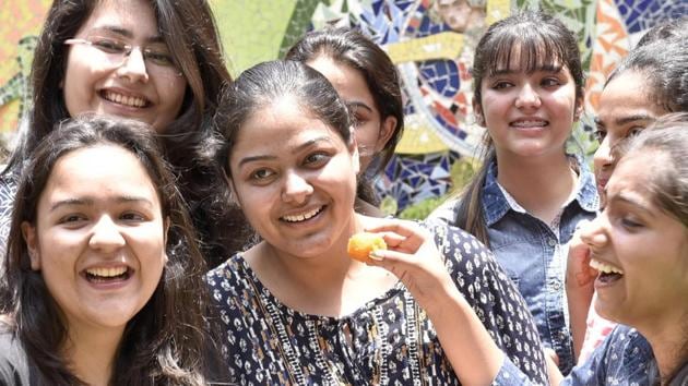 Premansh Sahi (Centre) student of DAV Public school at Lawrence road, Amritsar, scored 98 % in humanities stream. (Gurpreet Singh/HT)