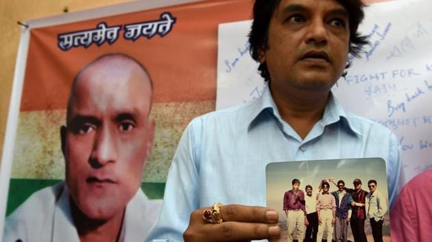 Kulbhushan Jadhav’s friend holds a photograph of the Indian national who was arrested in Pakistan, in Mumbai. (AFP File Photo) Kulbhushan Jadhav’s friend holds a photograph of the Indian national who was arrested in Pakistan, in Mumbai. (AFP File Photo)