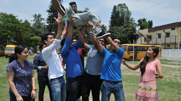 Students of a Dehradun school rejoice after CBSE Class 12 results were announced on Sunday. (Praveen Dandriyal /HT) Students of a Dehradun school rejoice after CBSE Class 12 results were announced on Sunday. (Praveen Dandriyal /HT)
