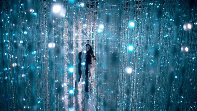 People walk through the Team Lab art installation at the 798 art district in Beijing. (NICOLAS ASFOURI / AFP)
