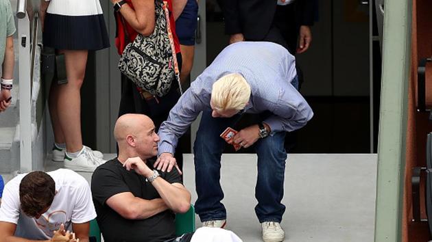 Andre Agassi, coach of Novak Djokovic, speaks with Boris Becker on day two of the French Open. (Getty Images) Andre Agassi, coach of Novak Djokovic, speaks with Boris Becker on day two of the French Open. (Getty Images)