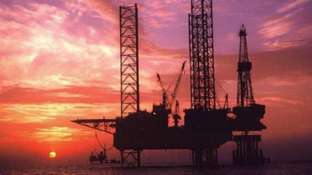 Sunset in the background of an offshore oil drilling platform. (Reuters photo) Sunset in the background of an offshore oil drilling platform. (Reuters photo)