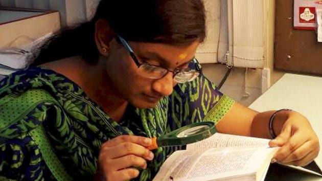 Dharshana MV scored third highest marks in CBSE class XII exams in differently-abled category. Hailing from Krishnagiri in Tamil Nadu, Dharshan, who has almost nil vision in right eye and partial in left, uses magnifying glass to read. (PTI)
