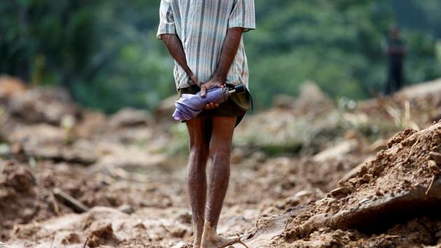 A man looks at the landslide site. The rescue, diving and medical teams on board will work in coordination with the Sri Lankan Navy and other authorities, and are now being deployed in the worst affected areas, particularly Ratnapura and Horana. (Dinuka Liyanawatte/REUTERS) A man looks at the landslide site. The rescue, diving and medical teams on board will work in coordination with the Sri Lankan Navy and other authorities, and are now being deployed in the worst affected areas, particularly Ratnapura and Horana. (Dinuka Liyanawatte/REUTERS)