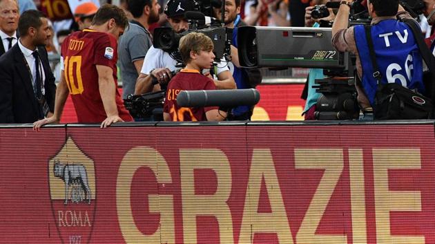 Roma's forward from Italy Francesco Totti (L) reacts during a ceremony to celebrate his last match with AS Roma. (AFP)