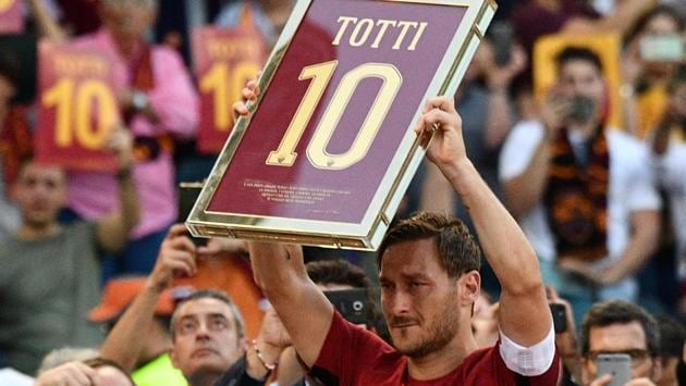 Roma's forward from Italy Francesco Totti holds a framed Number 10. (AFP)