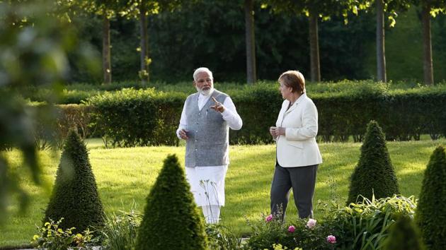 German Chancellor Angela Merkel listens to Indian Prime Minister Narendra Modi during their meeting at the German government guesthouse Meseberg Palace in Meseberg, Germany on May 29. (REUTERS)