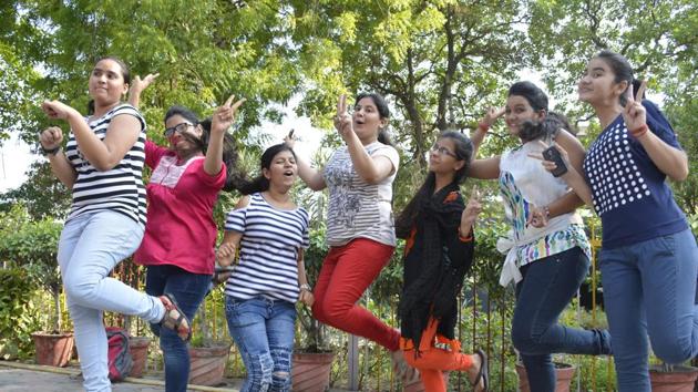 Class 12 students celebrate their results at a school in Ghaziabad on Monday. (Sakib Ali/HT Photo) Class 12 students celebrate their results at a school in Ghaziabad on Monday. (Sakib Ali/HT Photo)