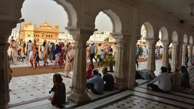 Devotees taking paying obeisance at Golden Temple on the occasion of martyrdom anniversary of Sikh Guru Arjan Dev in Amritsar on Monday. (Gurpreet Singh/HT Photo)