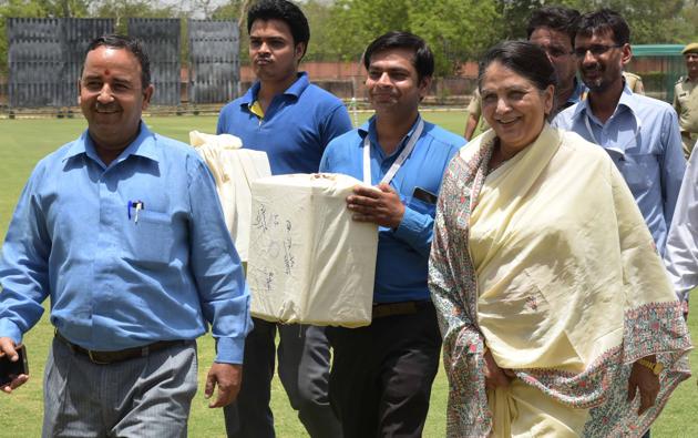 Justice Gyansudha Mishra , the ombudsman appointed for the RCA elections, with ballot boxes in Jaipur on Monday. (prabhakar sharma/HT Photo) Justice Gyansudha Mishra , the ombudsman appointed for the RCA elections, with ballot boxes in Jaipur on Monday. (prabhakar sharma/HT Photo)