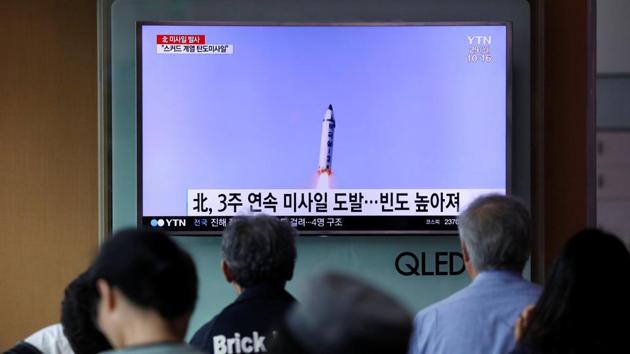 People watch a television broadcasting a news report on North Korea firing what appeared to be a short-range ballistic missile, at a railway station in Seoul.(REUTERS)