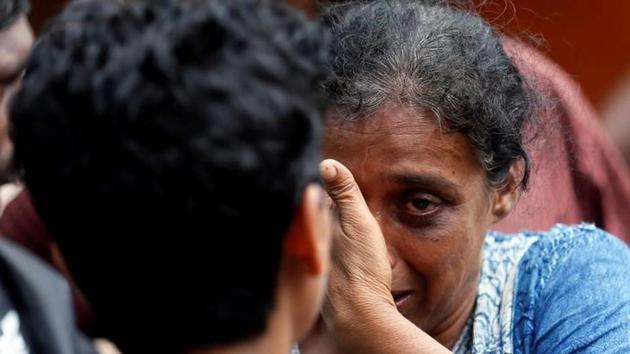 A relative of a victim reacts at a landslide site. The incessant rains experienced since Thursday night have driven nearly half a million people out of their inundated homes in the southern and western regions. (Dinuka Liyanawatte/Reuters) A relative of a victim reacts at a landslide site. The incessant rains experienced since Thursday night have driven nearly half a million people out of their inundated homes in the southern and western regions. (Dinuka Liyanawatte/Reuters)