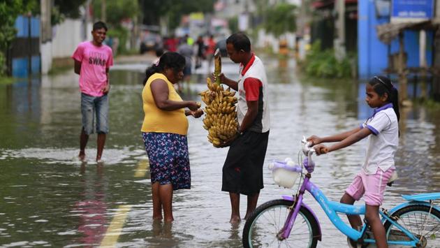 A Sri Lankan man offers bananas to a woman. The second Indian relief ship, INS Shardul arrived at Colombo Port yesterday. It has nearly 200 personnel on board, including specialised rescue, diving and medical teams, as well as a large amount of relief material and Gemini inflatable boats. (Eranga Jayawardena/AP) A Sri Lankan man offers bananas to a woman. The second Indian relief ship, INS Shardul arrived at Colombo Port yesterday. It has nearly 200 personnel on board, including specialised rescue, diving and medical teams, as well as a large amount of relief material and Gemini inflatable boats. (Eranga Jayawardena/AP)