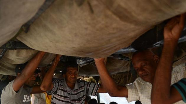 Sri Lankan flood victims are evacuated on an army truck in Athweltota village in Kalutara. Flood waters were receding in the worst affected districts of Ratnapura and Kalutara but the authorities said cleaning up operations could take weeks. (Lakruwan wanniarachchi/AFP) Sri Lankan flood victims are evacuated on an army truck in Athweltota village in Kalutara. Flood waters were receding in the worst affected districts of Ratnapura and Kalutara but the authorities said cleaning up operations could take weeks. (Lakruwan wanniarachchi/AFP)