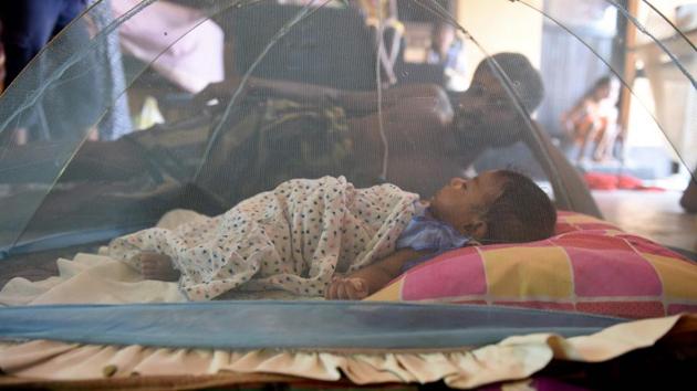 A Sri Lankan child and man rest at a relief camp after being evacuated following flooding in the suburb of Kaduwela in the capital Colombo. Some 412 houses were fully damaged with over 4,200 houses suffering partial damage. Some 471,000 people remain displaced while over 75,000 people are currently being housed in over 330 temporary relief accommodation. (Ishara S. Kodikara/AFP) A Sri Lankan child and man rest at a relief camp after being evacuated following flooding in the suburb of Kaduwela in the capital Colombo. Some 412 houses were fully damaged with over 4,200 houses suffering partial damage. Some 471,000 people remain displaced while over 75,000 people are currently being housed in over 330 temporary relief accommodation. (Ishara S. Kodikara/AFP)