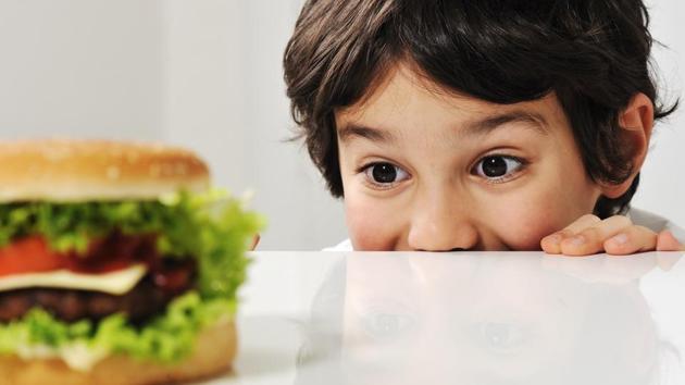 Boys who eat high-fat diet from childhood develop a proclivity to junk food as adults.(Shutterstock)