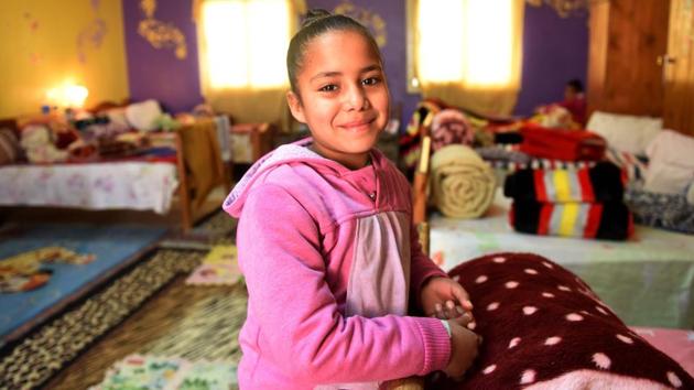 An Egyptian girl smiles on camera as she stands in a bedroom. According to official figures about 24 million people, nearly a third of the country’s 90 million population live below the poverty line. (Mohamed el-Shahed/AFP) An Egyptian girl smiles on camera as she stands in a bedroom. According to official figures about 24 million people, nearly a third of the country’s 90 million population live below the poverty line. (Mohamed el-Shahed/AFP)