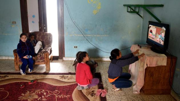 Egyptian children watch TV at the shelter. Hannah Aboulghar said that the street children come mainly from the mushrooming “poverty belt” of slums outside cities such as the capital and Alexandria. Government estimates show about eight million Egyptians live in such areas. (Mohamed el-Shahed/AFP) Egyptian children watch TV at the shelter. Hannah Aboulghar said that the street children come mainly from the mushrooming “poverty belt” of slums outside cities such as the capital and Alexandria. Government estimates show about eight million Egyptians live in such areas. (Mohamed el-Shahed/AFP)