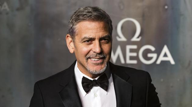 George Clooney poses for photographers upon arrival at the party being held for the 60th anniversary of the Omega Speedster watch in London. (Grant Pollard/Invision/AP) George Clooney poses for photographers upon arrival at the party being held for the 60th anniversary of the Omega Speedster watch in London. (Grant Pollard/Invision/AP)