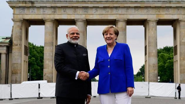 Prime Minister Narendra Modi with German chancellor Angela Merkel in front of the Brandenburg Gate in Berlin on Tuesday. (AFP Photo) Prime Minister Narendra Modi with German chancellor Angela Merkel in front of the Brandenburg Gate in Berlin on Tuesday. (AFP Photo)