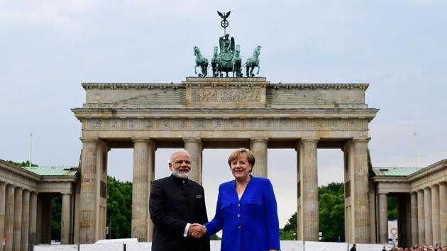 German Chancellor Angela Merkel shakes hands with Indian Prime Minister Narendra Modi in front of the Brandenburg Gate in Berlin on May 30. (AFP Photo) German Chancellor Angela Merkel shakes hands with Indian Prime Minister Narendra Modi in front of the Brandenburg Gate in Berlin on May 30. (AFP Photo)