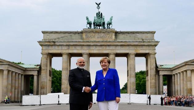 German Chancellor Angela Merkel shakes hands with Indian Prime Minister Narendra Modi in front of the Brandenburg Gate in Berlin on May 30, 2017. (AFP) German Chancellor Angela Merkel shakes hands with Indian Prime Minister Narendra Modi in front of the Brandenburg Gate in Berlin on May 30, 2017. (AFP)