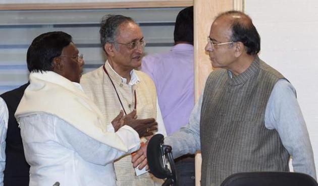 New Delhi: Union Minister for Finance and Corporate Affairs Arun Jaitley talks to West Bengal Finance Minister Amit Mitra and Puducherry CM V Narayanasami at GST Council Meeting in New Delhi.(PTI)