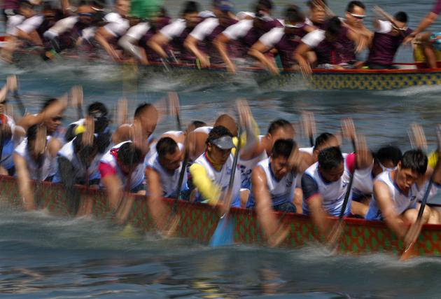 Dragon boat teams compete during the race in Hong Kong (AP)