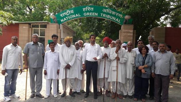 Around 30-35 senior citizens of Bandhwari village held a protest on the NGT premises in Delhi on Tuesday. Around 30-35 senior citizens of Bandhwari village held a protest on the NGT premises in Delhi on Tuesday.