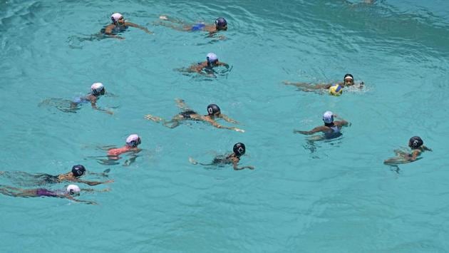 Children attend a swimming class during a summer camp at Elphinstone Road. (Pratik Chorge/HT Photo)