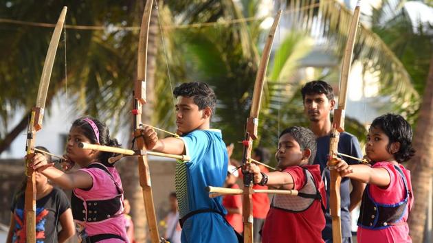 Children try their hands at hitting the bull’s eye during an archery workshop at Arjuna Sports Academy in Dadar . (Pratik Chorge/HT Photo)