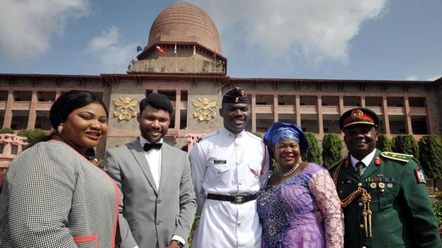 Nigerian cadet SJT Minimah strikes a pose with his family. (HT Photos) 