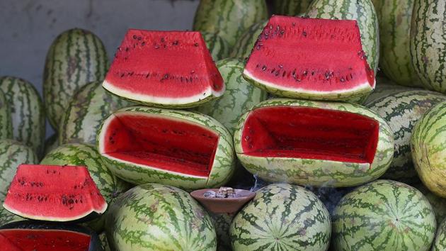 Although widely known as a fruit, some researchers believe that watermelon is a vegetable as it comes from a family of cucumber, squash and pumpkins. Oklahoma even declared watermelons as their state vegetable.  (Raj K Raj/HT PHOTO) 