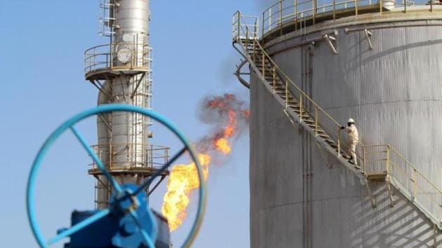 A worker climbs stairs at the Halfaya oilfield in Amara, southeast of Baghdad. (Reuters photo) A worker climbs stairs at the Halfaya oilfield in Amara, southeast of Baghdad. (Reuters photo)