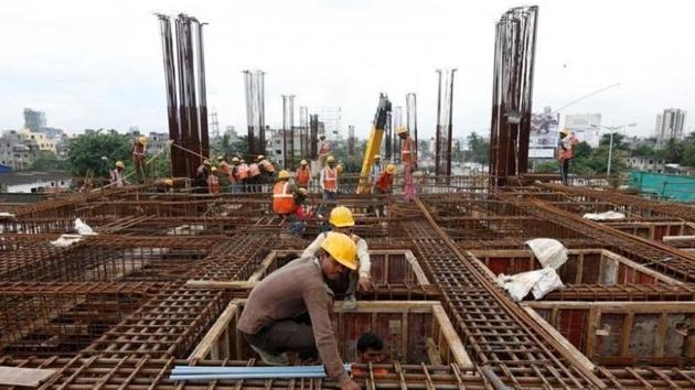 Labourers work at the construction site of a metro rail station in Kolkata. (Reuters photo) Labourers work at the construction site of a metro rail station in Kolkata. (Reuters photo)